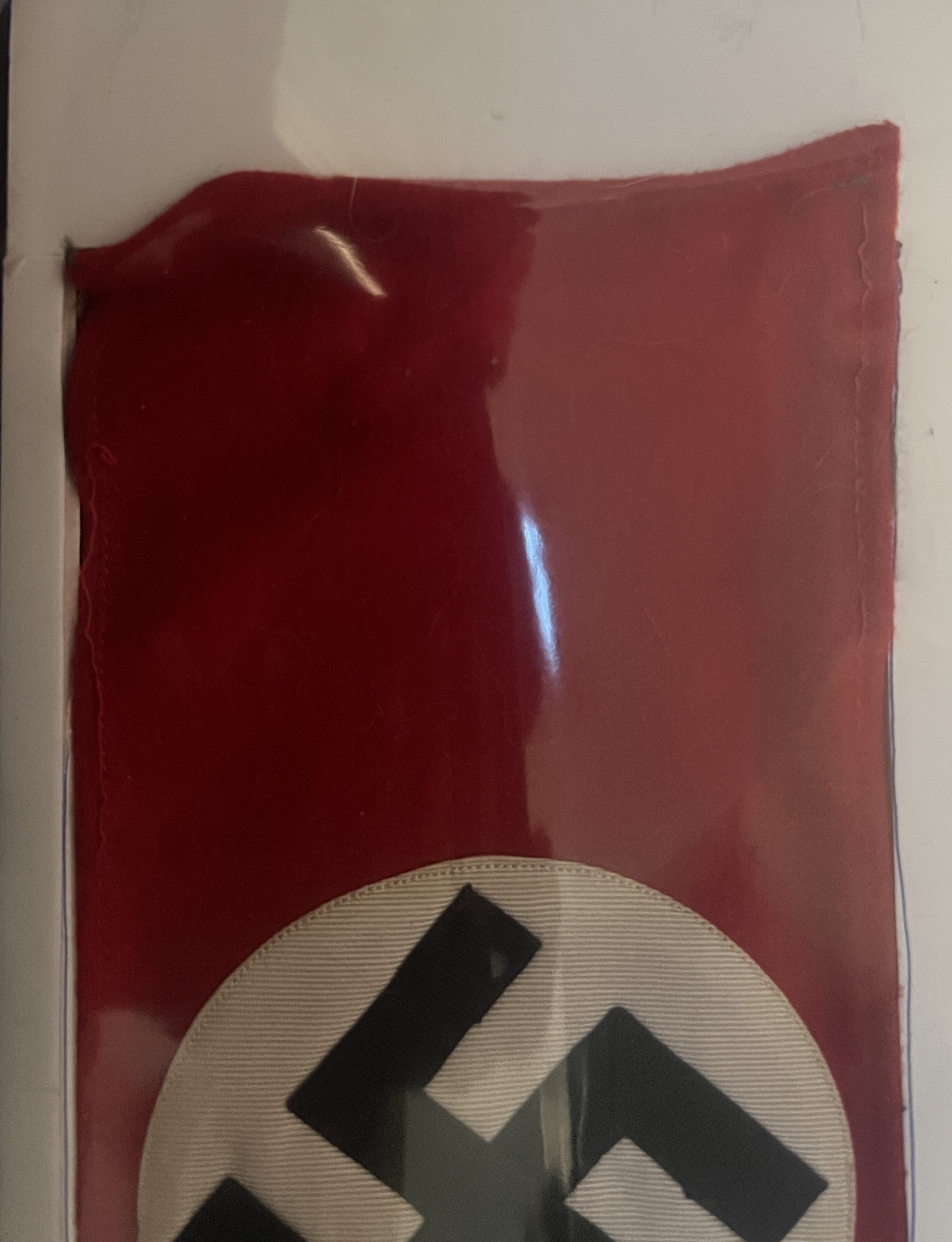 black swastika, white circle, red band