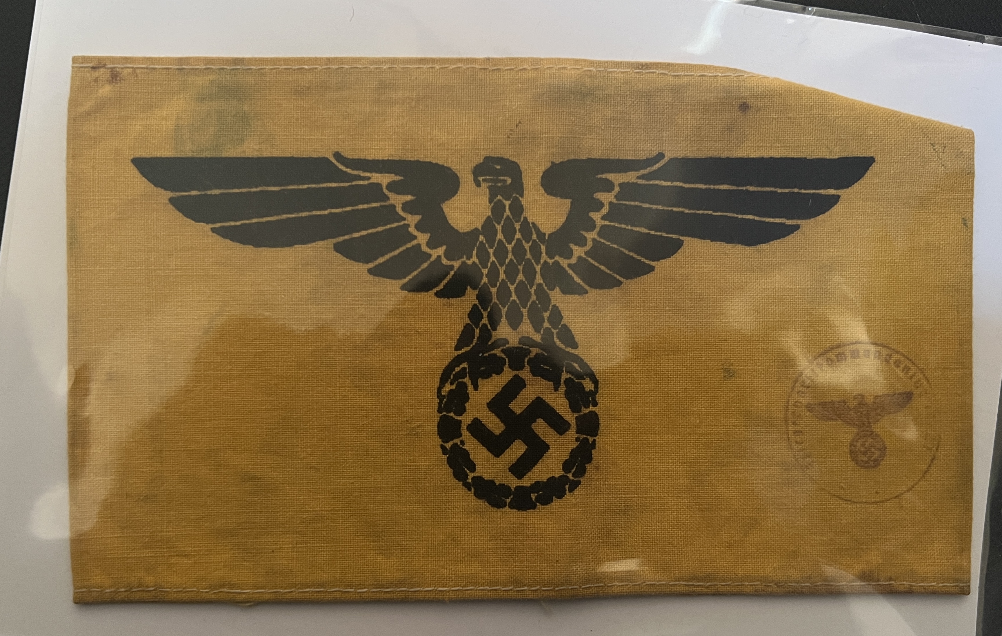 black eagle and swastika upon yellow band, striking simple design