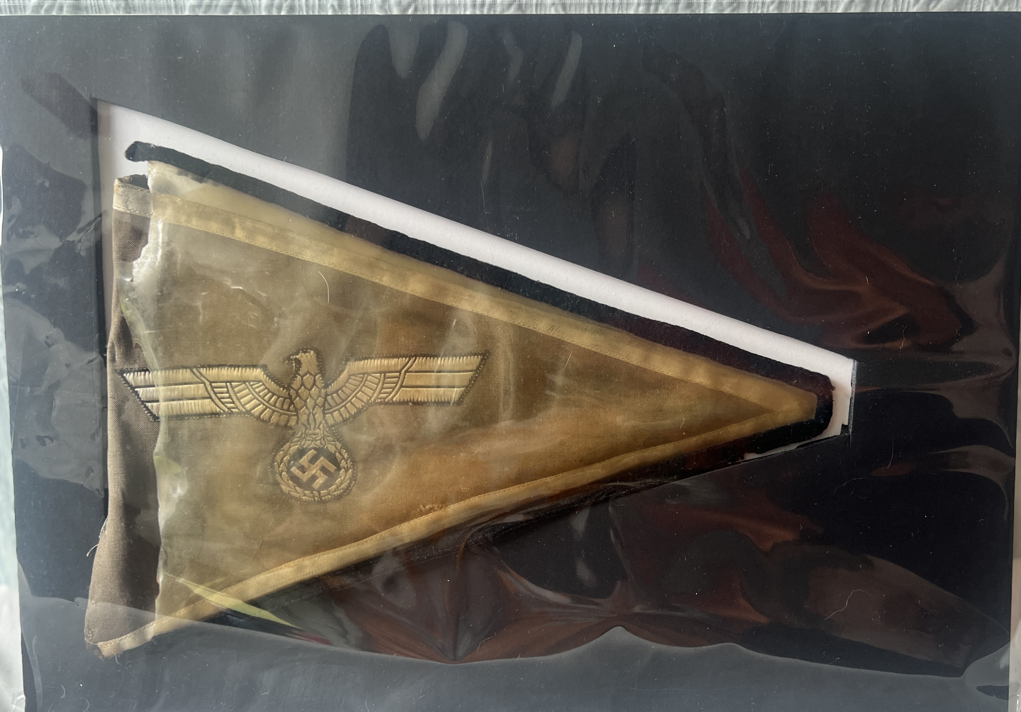 grey triangle, cream eagle and swastika, yellowed clear cover